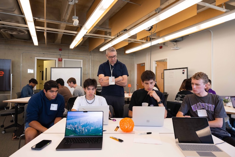 Instructor helping students